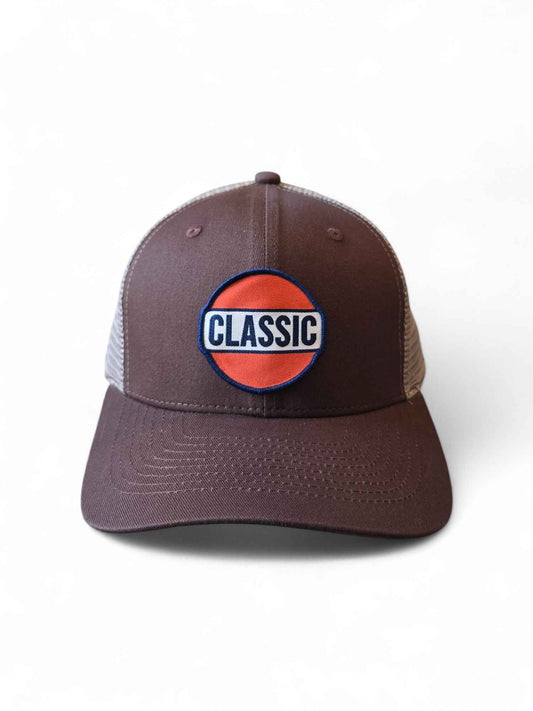 Brown and tan retro trucker hat with Classic patch in red, white, and blue, mesh back, and snapback closure