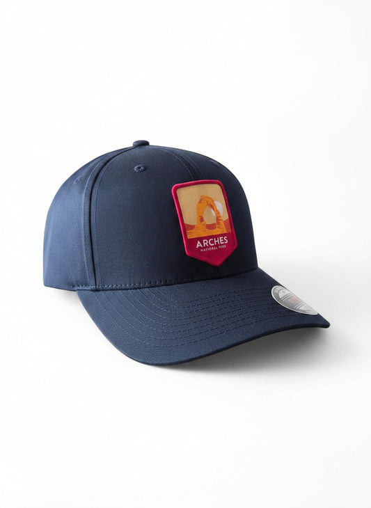 Moove Headwear navy blue baseball cap with Arches National Park logo patch, adjustable fit, sun protection.