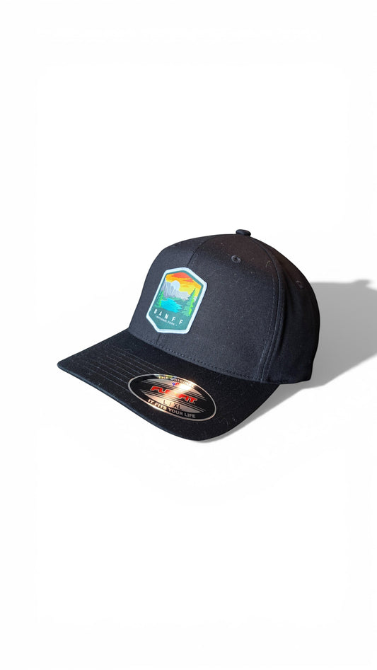 Moove Headwear black fitted cap with Banff National Park embroidered patch, flexible fit, breathable fabric.