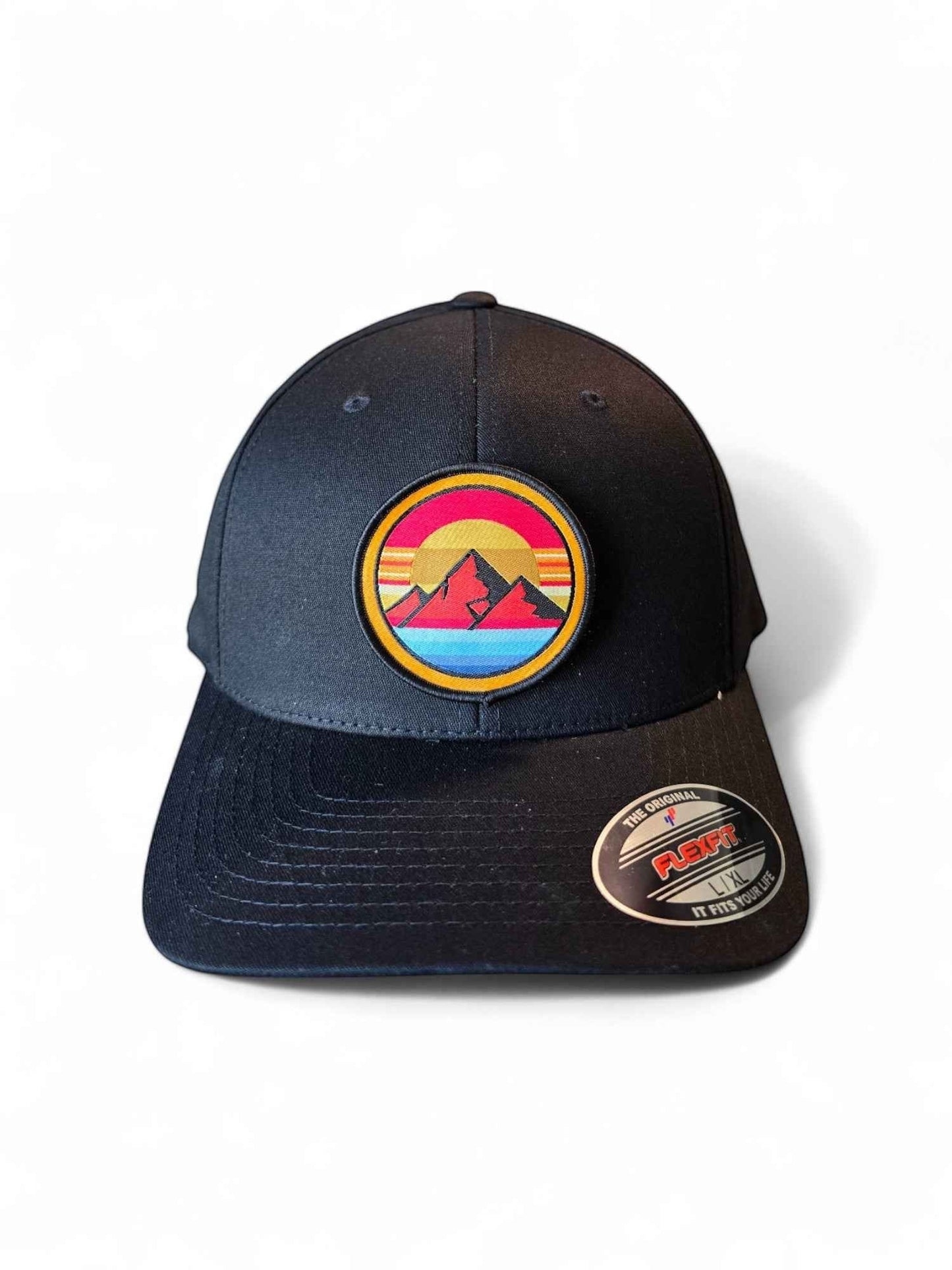 Moove Headwear black fitted hat with retro sunset mountain patch. Features embroidered design with 80s rainbow stripes.