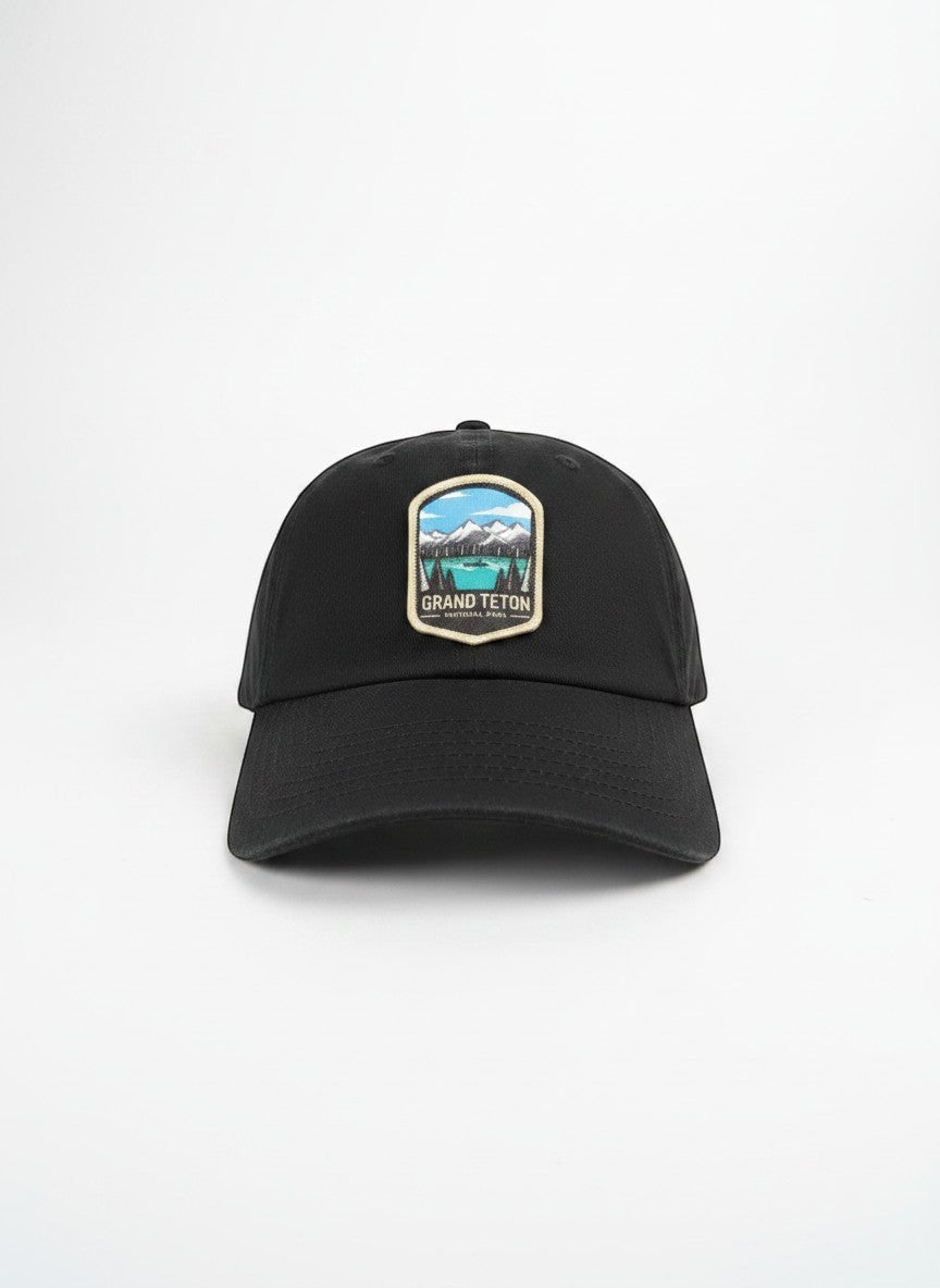 Moove Headwear black cotton dad hat with Grand Teton National Park embroidered patch and adjustable strap.