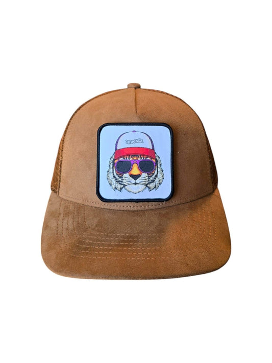 Moove Headwear brown suede trucker hat with mesh back and embroidered tiger patch wearing sunglasses.