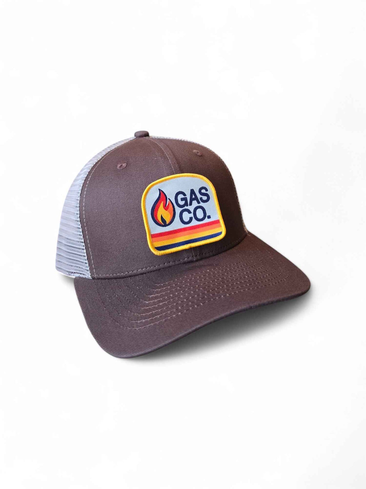 Brown and tan retro trucker hat with vintage Gas Co. flame patch, mesh back, and adjustable snapback closure