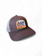 Brown and tan retro trucker hat with vintage Gas Co. flame patch, mesh back, and adjustable snapback closure