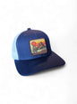 Navy blue and white retro trucker cap with vintage Mello Yello patch and adjustable mesh back