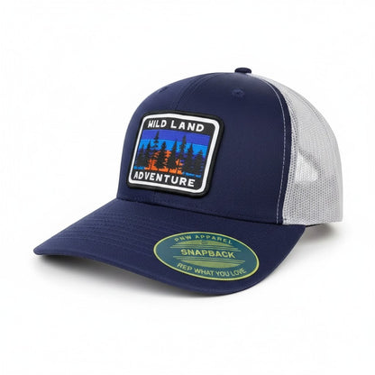 Moove Headwear navy blue trucker hat with mesh back and a patch depicting a forest landscape with the words "HILD LAND ADVENTURE"
