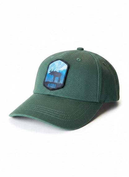 Moove Headwear dark green cotton baseball cap with Alaska moose and mountain patch. Adjustable dad hat style.