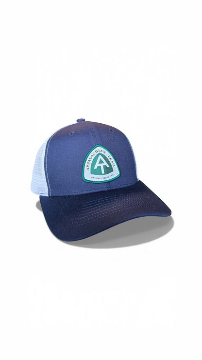 Moove Headwear navy blue trucker hat with white mesh back and Appalachian Trail logo patch.