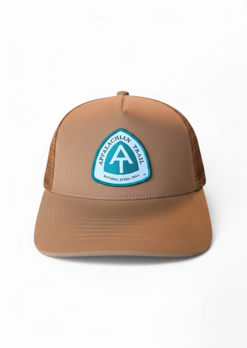 Moove Headwear brown suede trucker hat with mesh back and Appalachian Trail patch. Adjustable snapback closure.