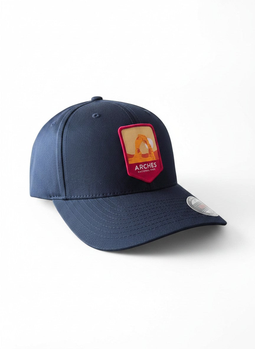 Moove Headwear navy blue baseball cap with Arches National Park logo patch, adjustable fit, sun protection.