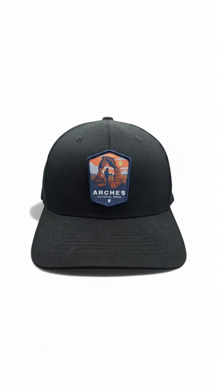 Moove Headwear black fitted baseball cap with Arches National Park patch featuring Delicate Arch and a hiker.