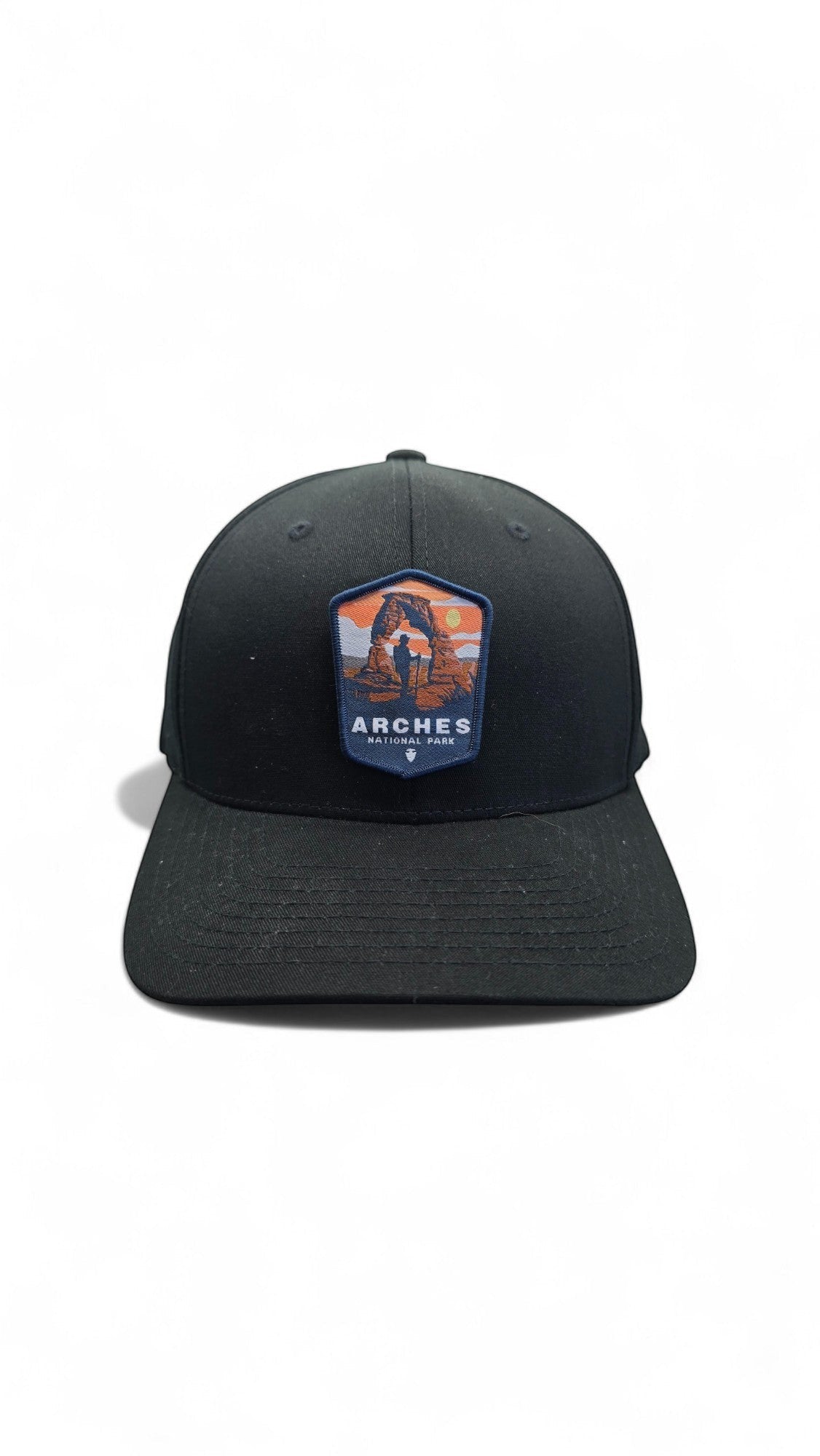 Moove Headwear black fitted baseball cap with Arches National Park patch featuring Delicate Arch and a hiker.