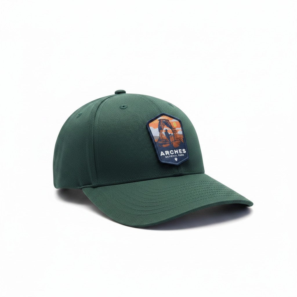 Moove Headwear Arches National Park fitted baseball cap in dark green with a woven patch featuring Delicate Arch.