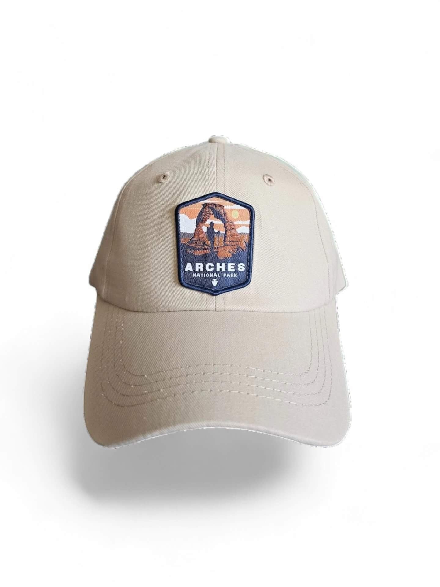 Moove Headwear tan baseball cap with Arches National Park embroidered patch, adjustable brass buckle closure.