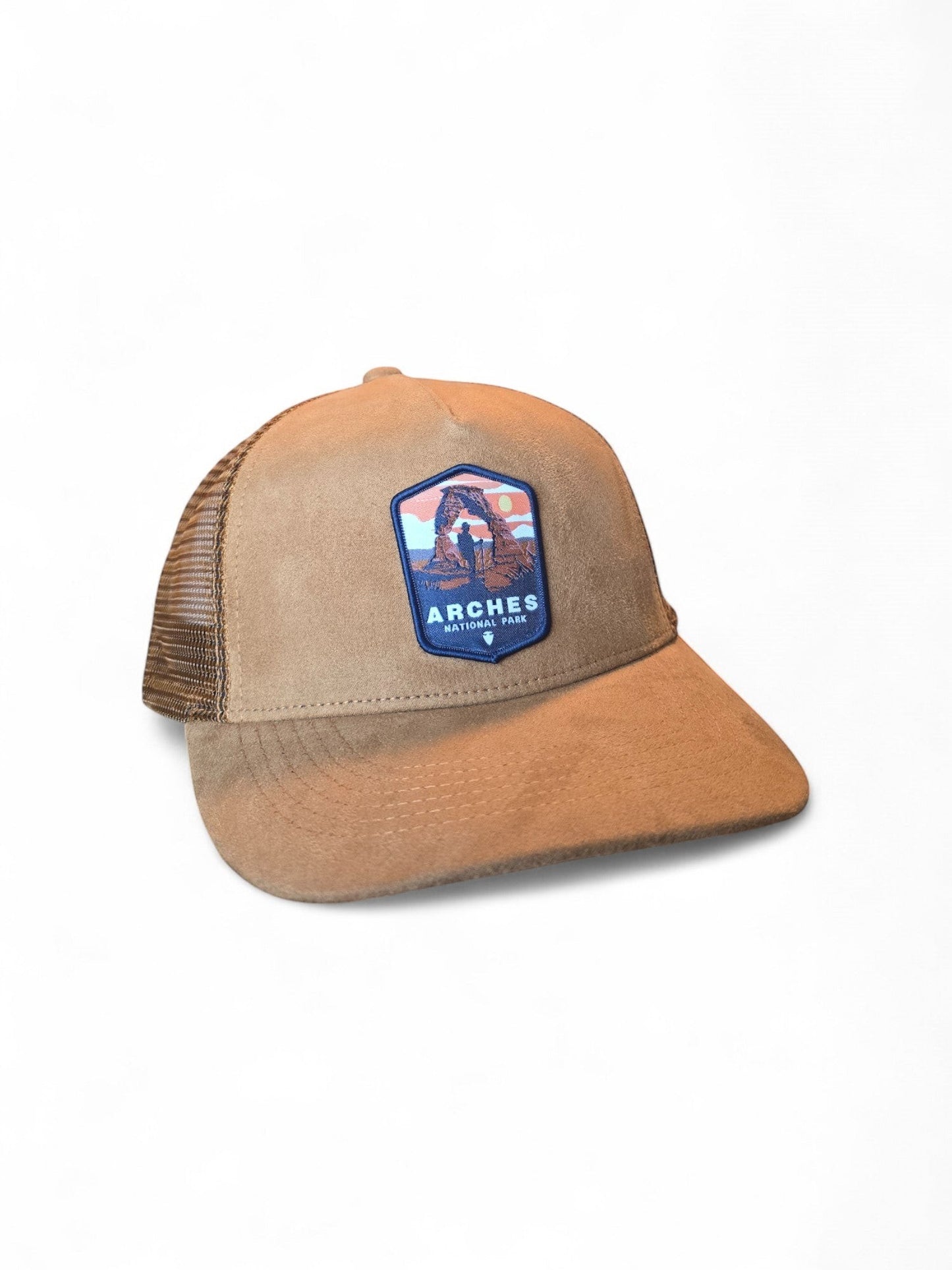 Moove Headwear tan suede trucker hat with mesh back and Arches National Park embroidered patch.