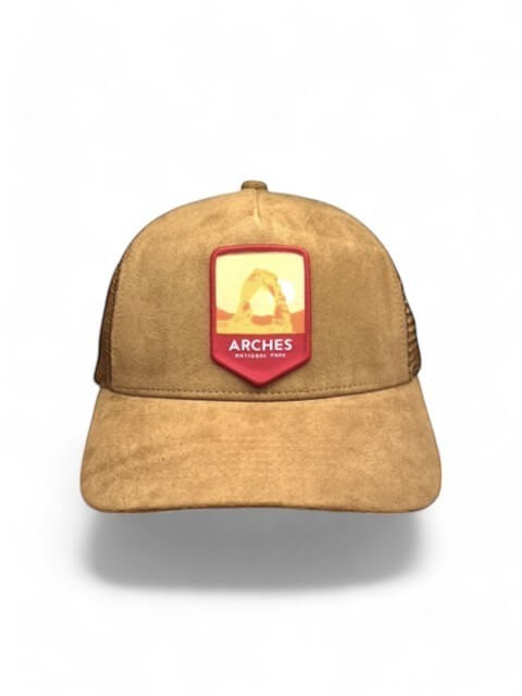 Moove Headwear tan suede trucker hat with mesh back and Arches National Park patch.