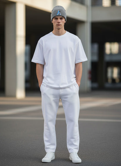 Moove Headwear Arizona AZ grey rib-knit beanie with a woven front patch worn by a man in a white outfit
