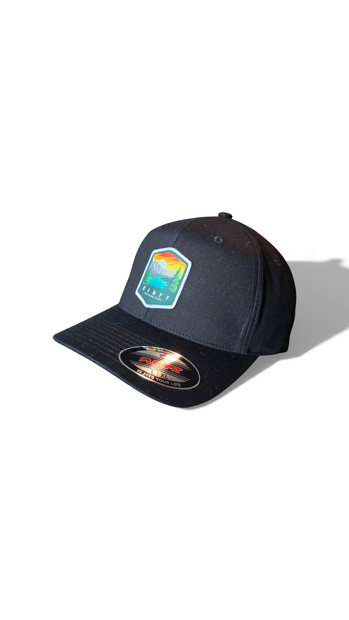 Moove Headwear black fitted cap with Banff National Park embroidered patch, flexible fit, breathable fabric.