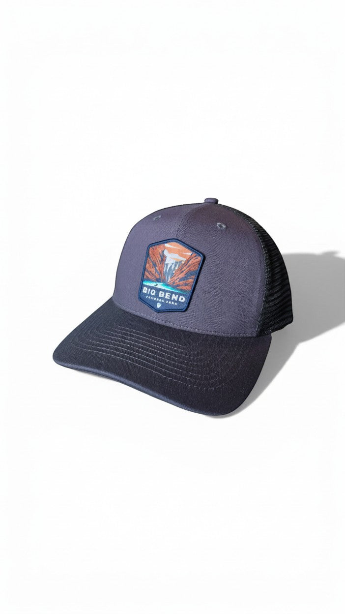 Moove Headwear Big Bend National Park trucker hat, heather grey front panels, black mesh back, adjustable snapback.