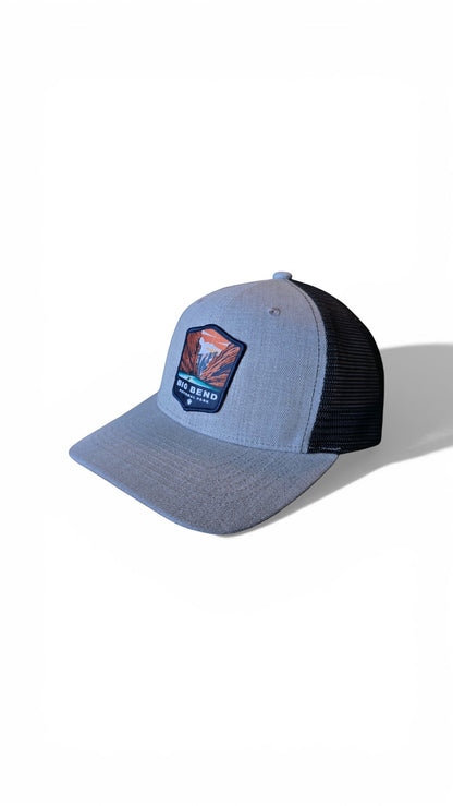 Moove Headwear Big Bend National Park trucker hat, heather grey front panels, black mesh back, adjustable snapback closure.
