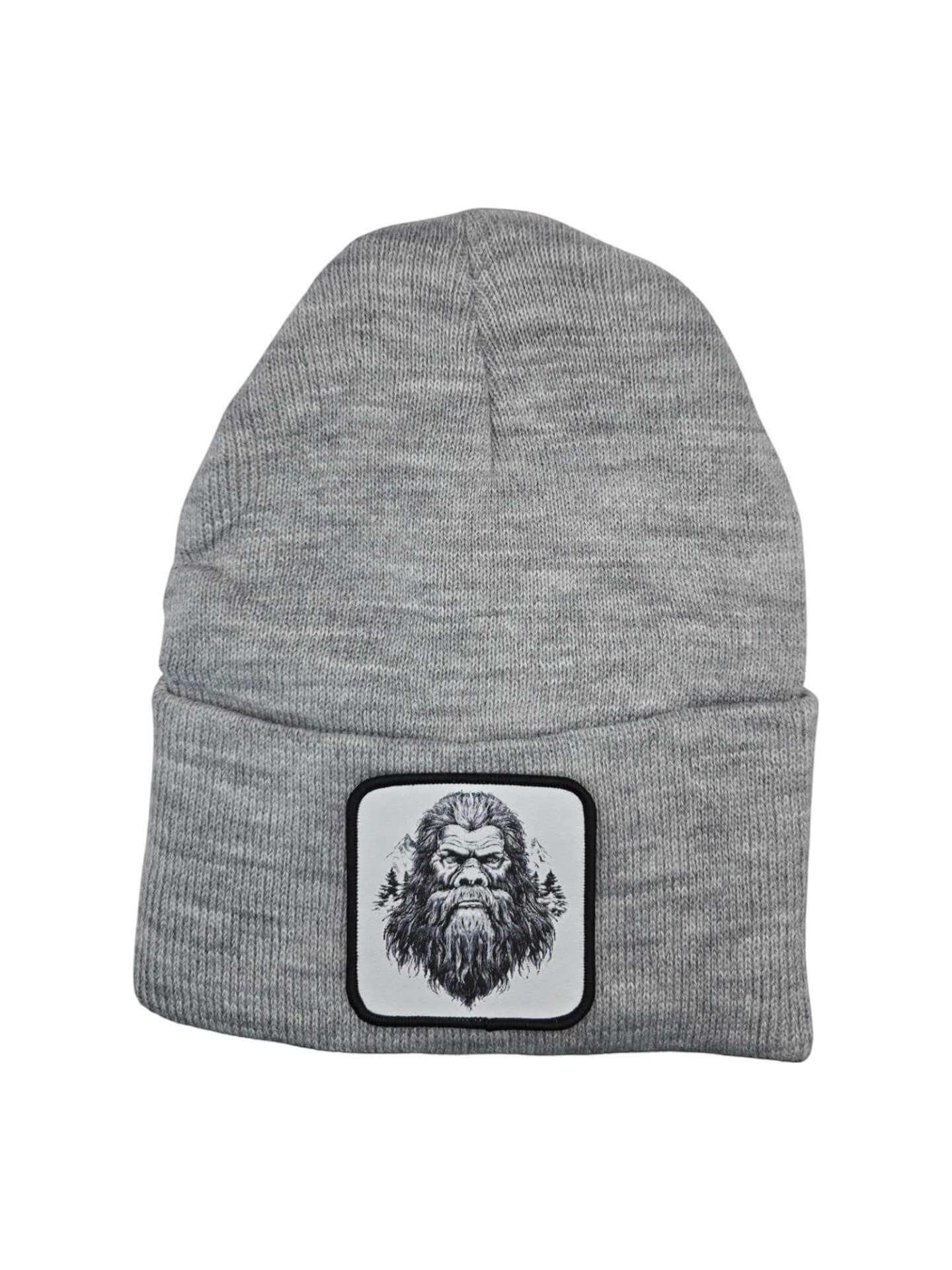 Moove Headwear grey acrylic knit beanie with a Bigfoot patch and mountain graphic. One size fits all.