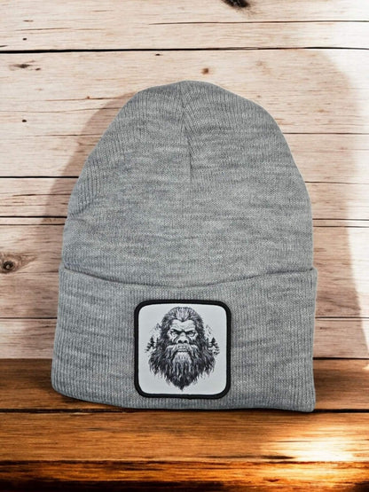 Moove Headwear grey acrylic knit beanie with a Bigfoot Sasquatch patch on the front. One size fits all.