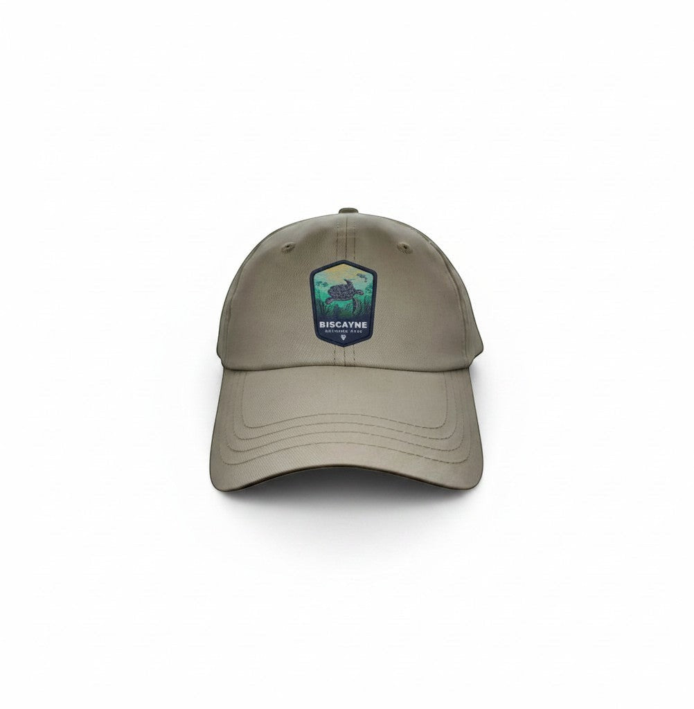 Moove Headwear khaki dad hat with Biscayne National Park embroidered patch featuring a sea turtle and coastal landscape.