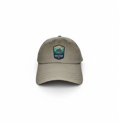 Moove Headwear khaki dad hat with Biscayne National Park embroidered patch featuring a sea turtle and coastal landscape.