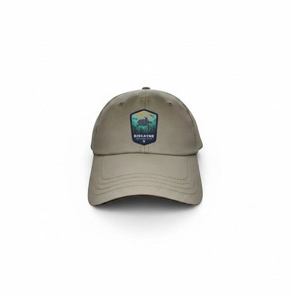 Moove Headwear tan baseball cap with Biscayne National Park embroidered patch featuring a sea turtle and mountains.