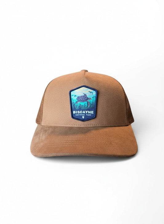 Moove Headwear tan suede trucker hat with mesh back and Biscayne National Park patch featuring a sea turtle.