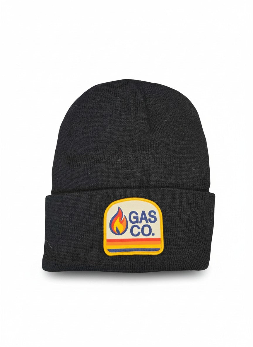 Moove Headwear black cuffed knit beanie with vintage Gas Co. flame logo patch. Soft, stretchy fabric for unisex fit.