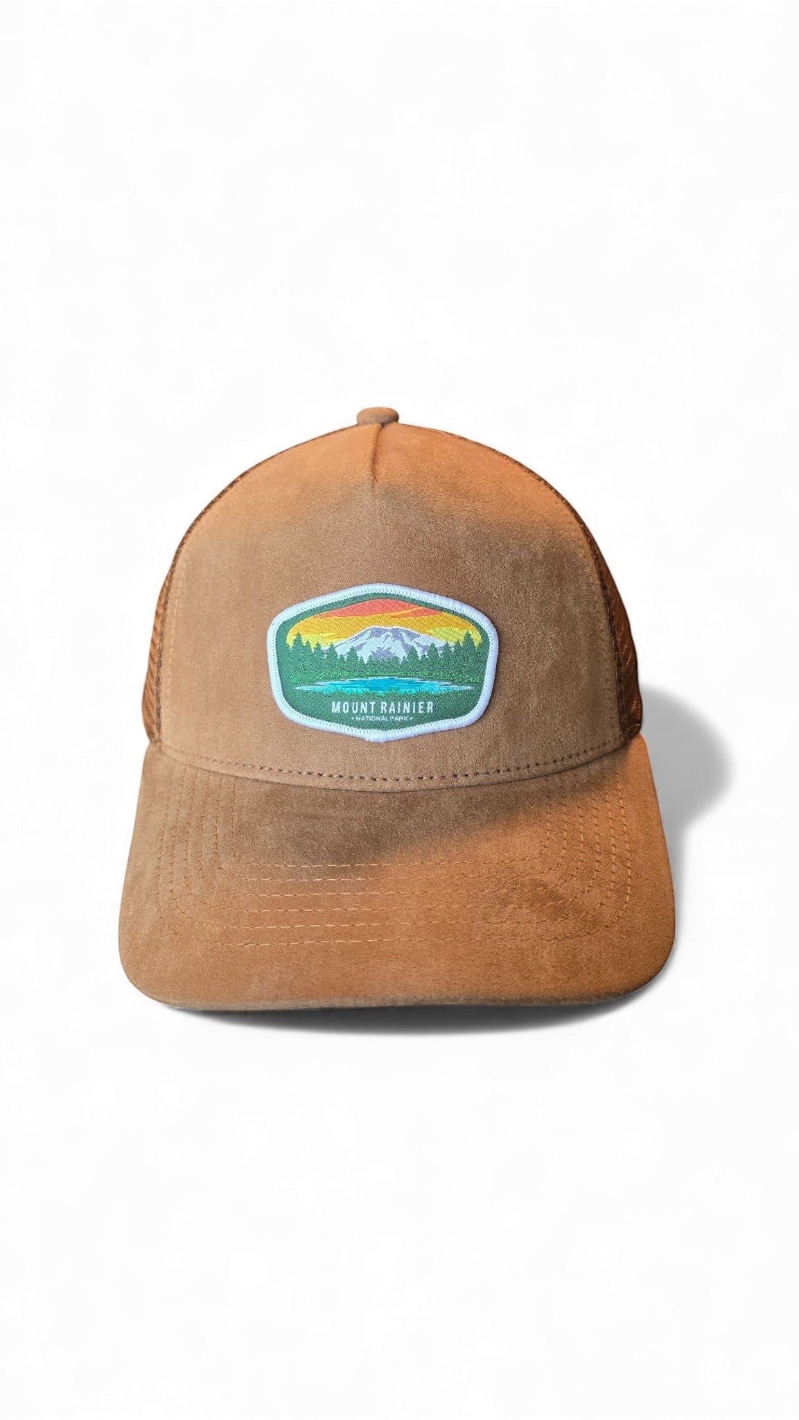 Moove Headwear brown suede trucker hat with mesh back and Mount Rainier National Park patch. Adjustable fit.