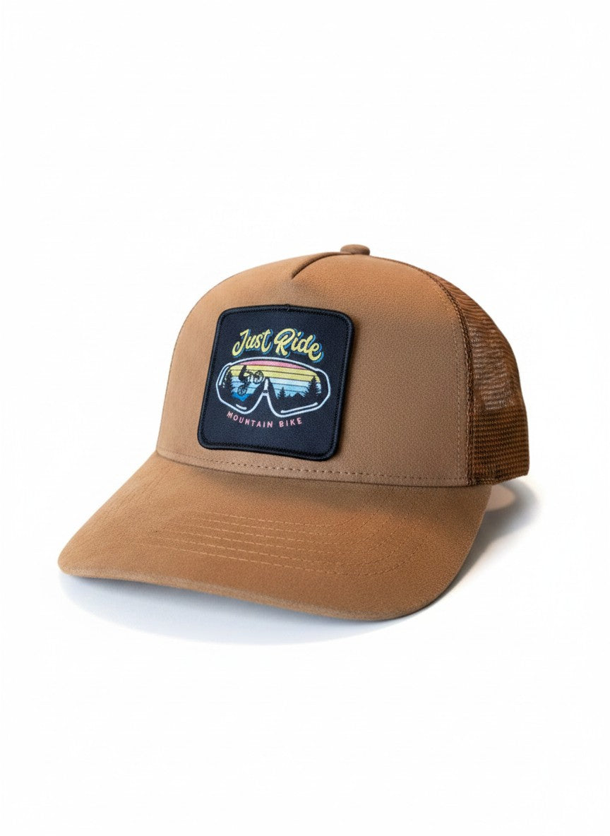 Moove Headwear brown suede trucker hat with mesh back and "Just Ride Mountain Bike" patch.