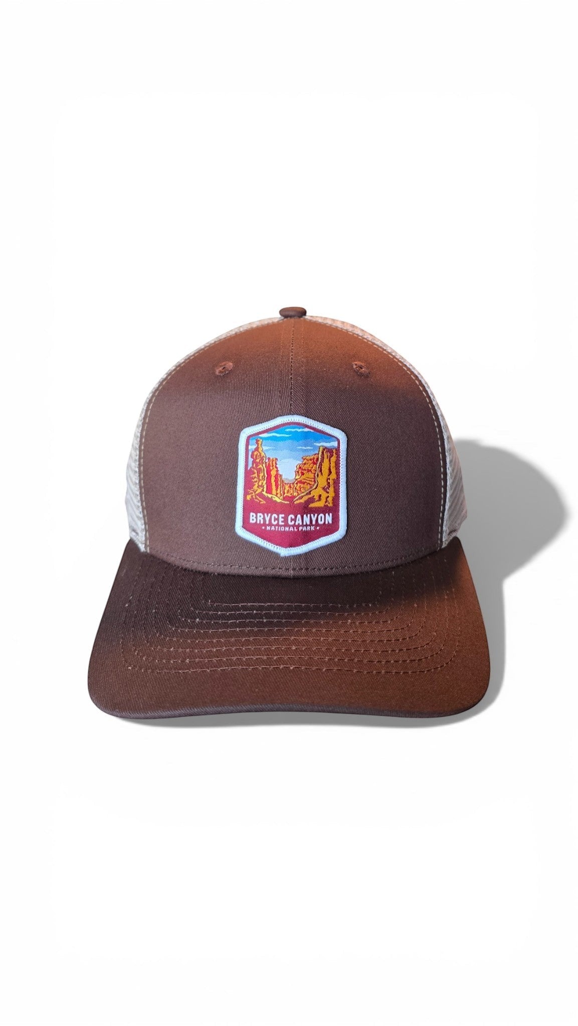 Moove Headwear brown trucker hat with mesh back and Bryce Canyon National Park patch. Adjustable snapback.