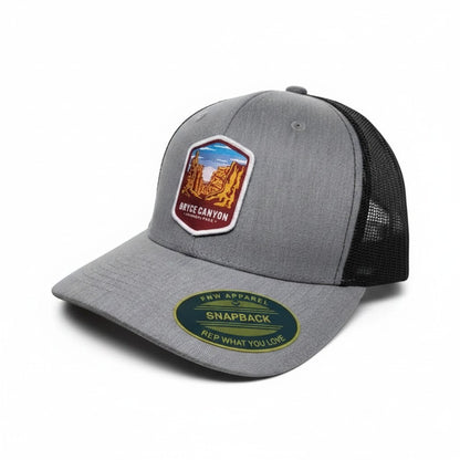 Moove Headwear grey trucker hat with Bryce Canyon National Park patch and black mesh back. Adjustable snapback.