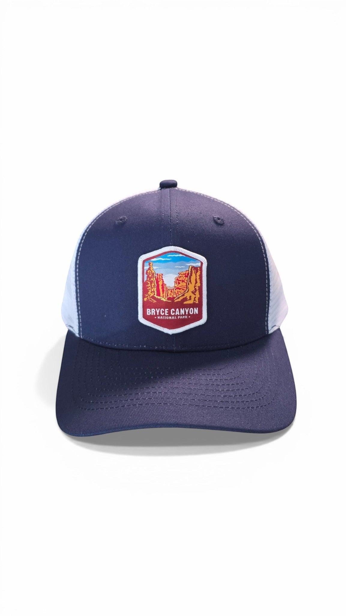 Moove Headwear navy blue trucker hat with adjustable snapback and Bryce Canyon National Park graphic patch.