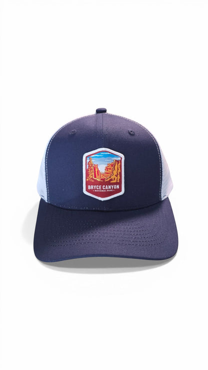 Moove Headwear navy blue trucker hat with adjustable snapback and Bryce Canyon National Park graphic patch.
