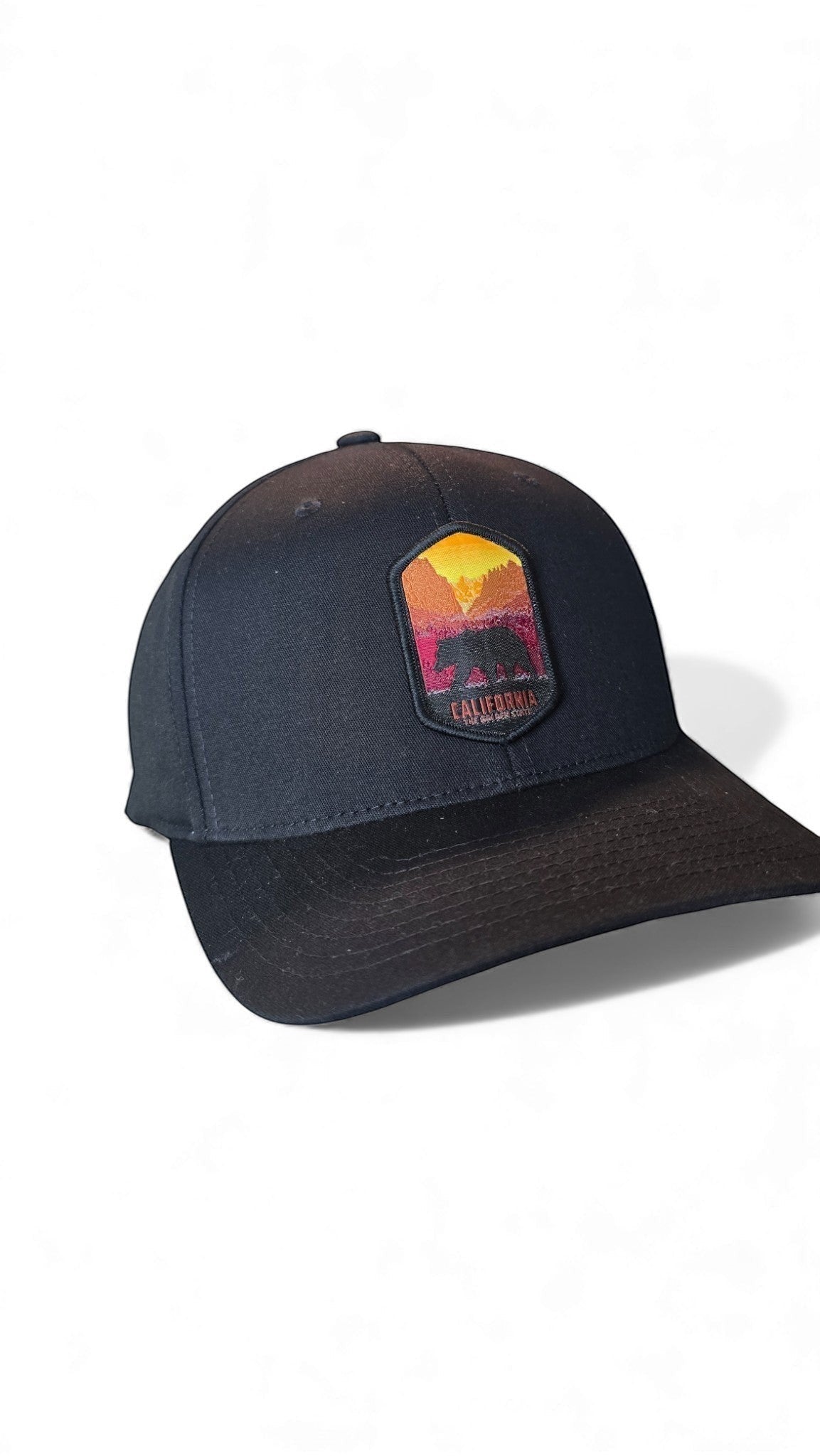 Moove Headwear black fitted baseball cap with a California bear graphic patch and sunset mountain scene.