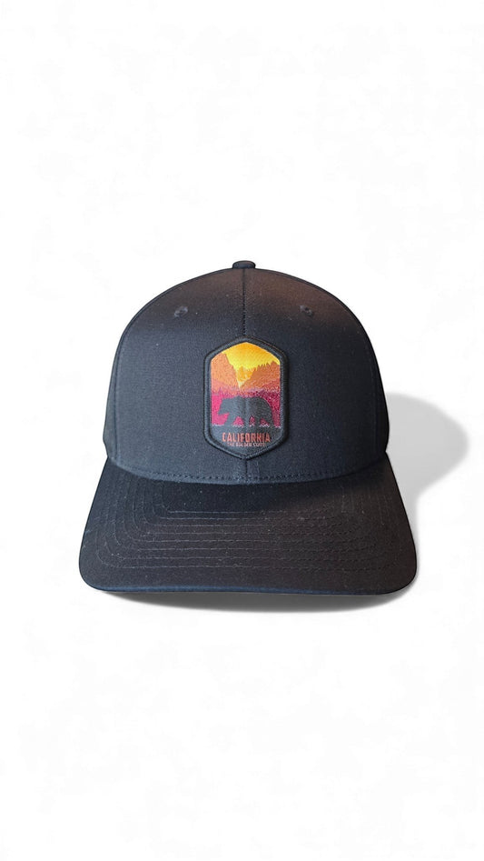 Moove Headwear black fitted baseball cap with a colorful California bear and mountain landscape patch.