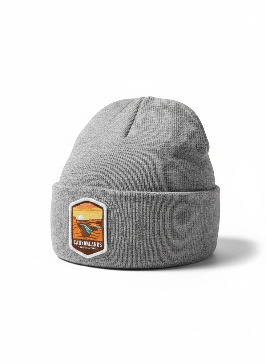 Moove Headwear grey acrylic knit beanie with embroidered Canyonlands National Park patch. One size fits all.