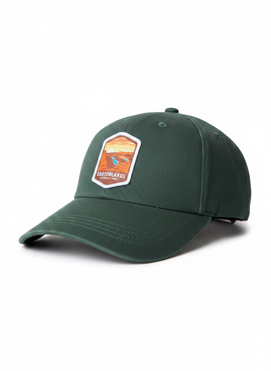 Moove Headwear dark green embroidered baseball cap featuring a patch of Canyonlands National Park with a desert landscape and river.