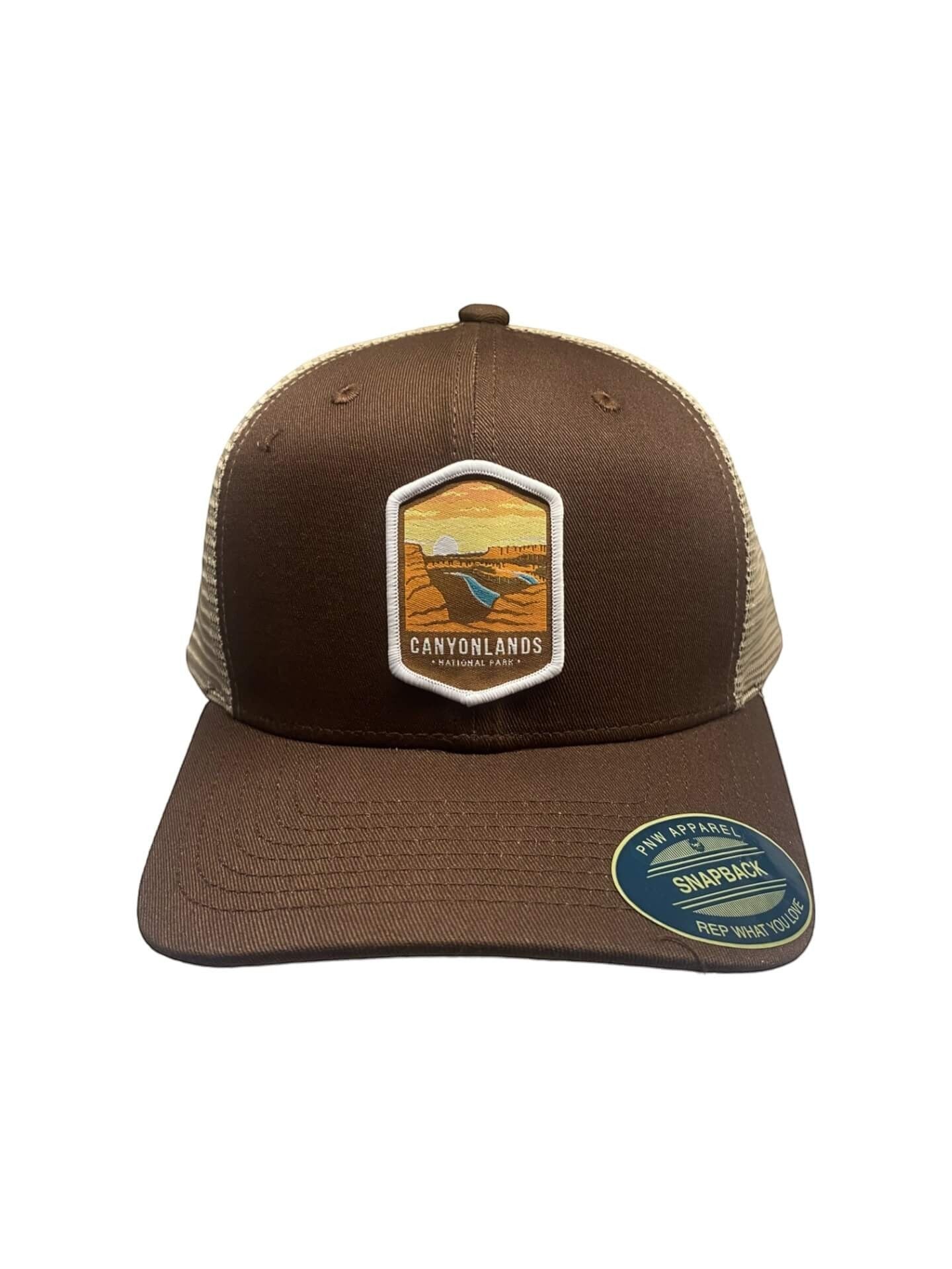 Moove Headwear brown trucker hat with mesh back and Canyonlands National Park emblem. Adjustable snap closure.