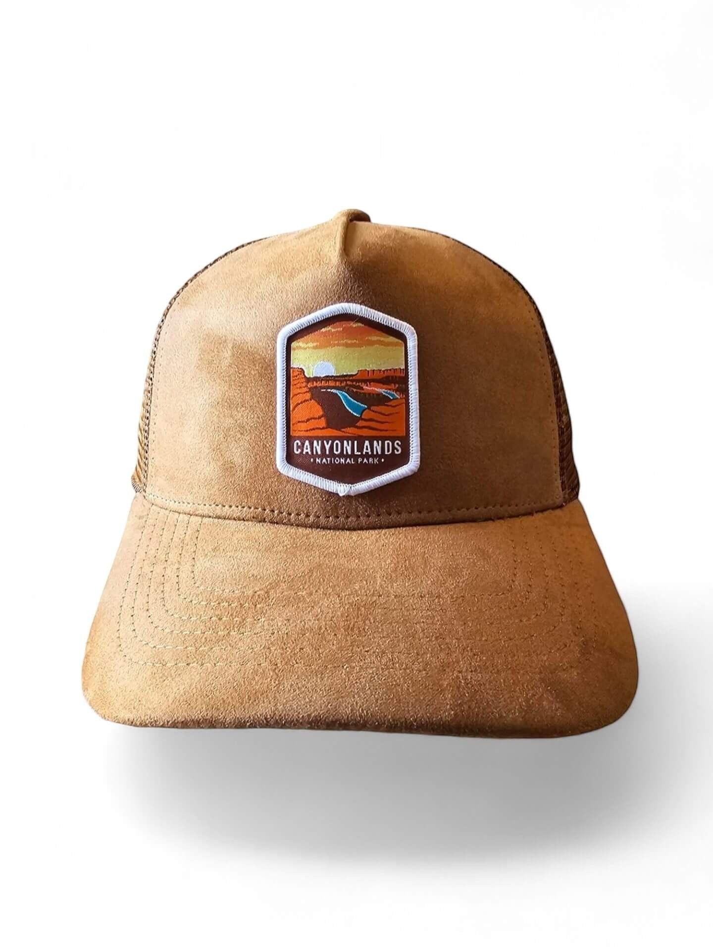 Moove Headwear brown suede trucker hat with mesh back and Canyonlands National Park patch. Adjustable snapback.