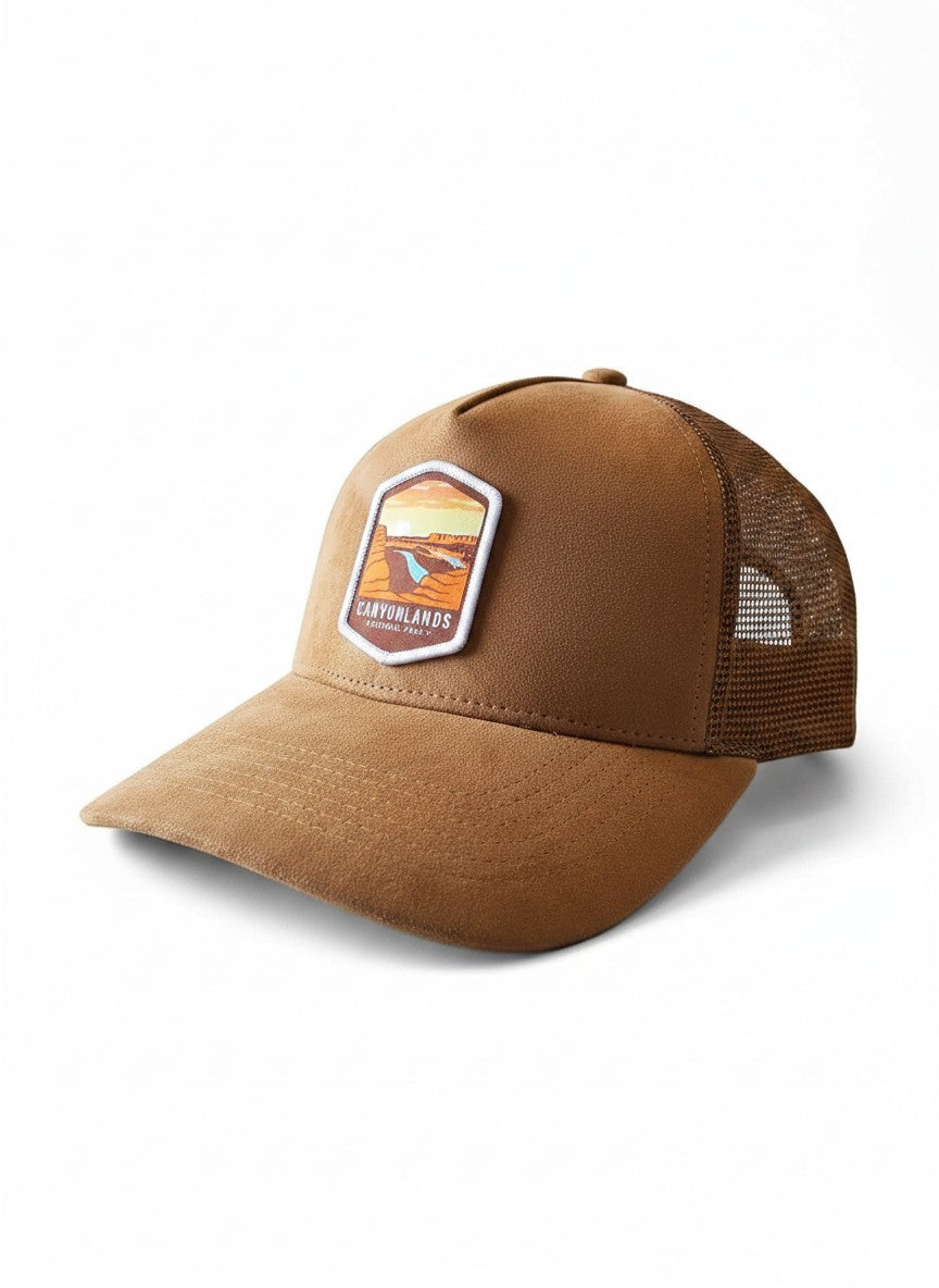 Moove Headwear brown suede trucker hat with mesh back and Canyonlands National Park patch. Adjustable snapback.