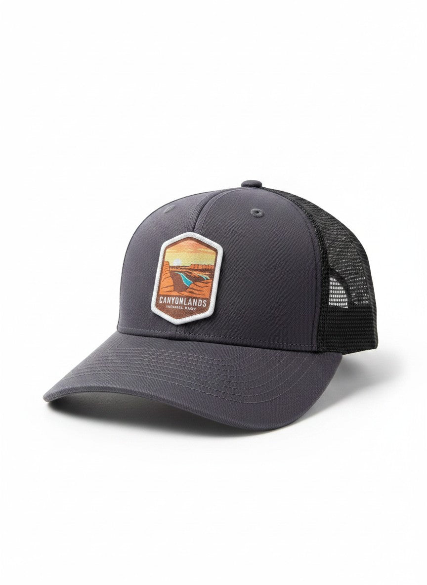 Moove Headwear dark grey trucker hat with breathable mesh back and Canyonlands National Park emblem.