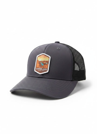 Moove Headwear dark grey trucker hat with breathable mesh back and Canyonlands National Park emblem.