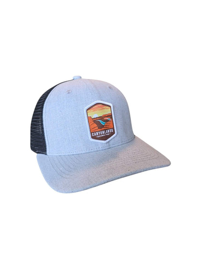 Moove Headwear light blue trucker hat with black mesh back and Canyonlands National Park patch.
