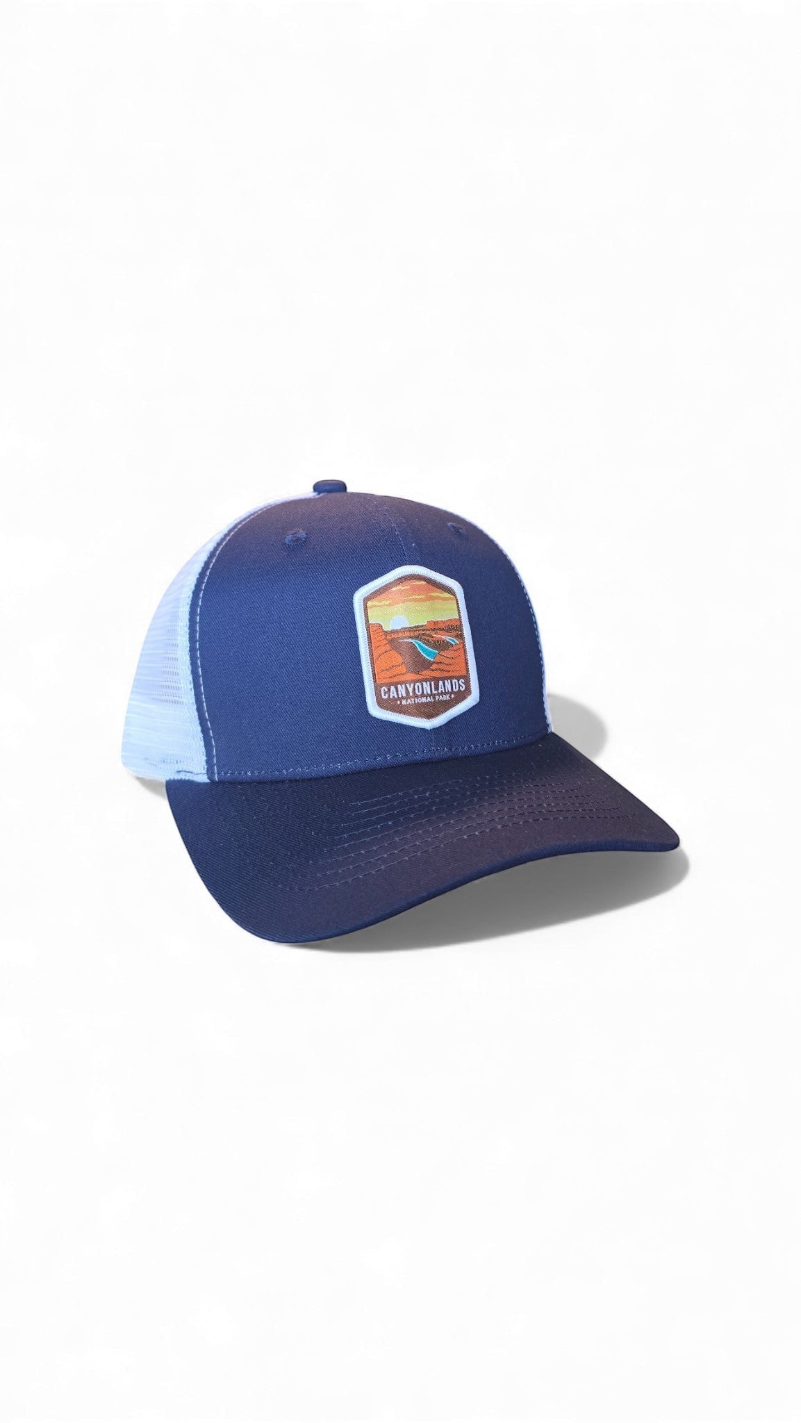 Moove Headwear navy blue trucker hat with white mesh back and Canyonlands National Park patch.