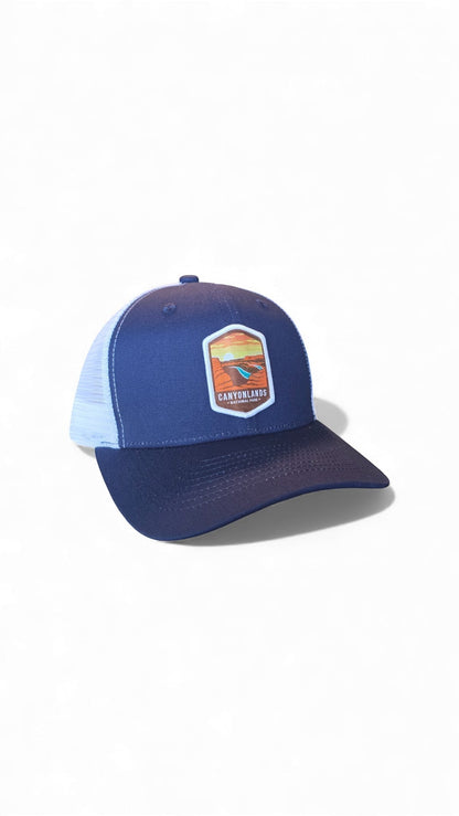 Moove Headwear navy blue trucker hat with white mesh back and Canyonlands National Park patch.