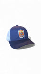 Moove Headwear navy blue trucker hat with white mesh back and Canyonlands National Park patch.